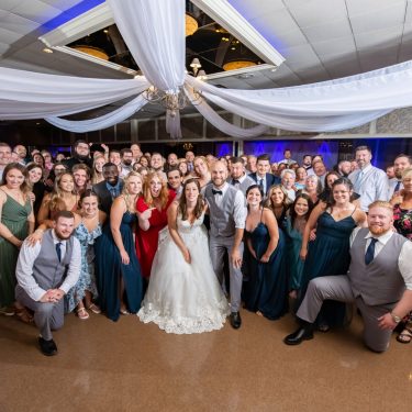 Wedding guests on dance floor in MI