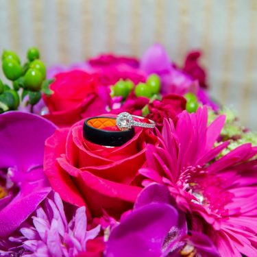 Wedding rings in pink flowers