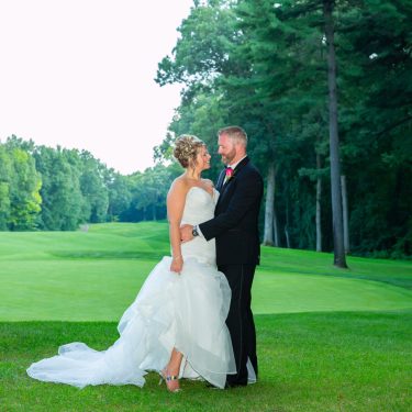 Bride and groom on golf course in MI