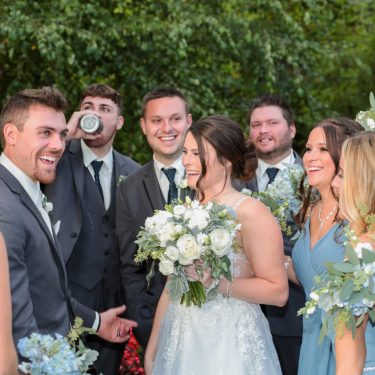 Bridal party in light blue and flowers
