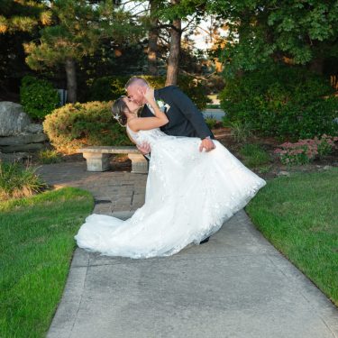 Married couple kissing in garden