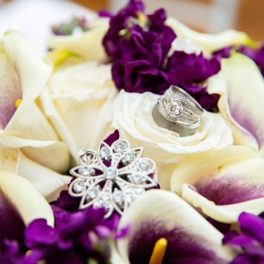 Wedding rings in purple flowers
