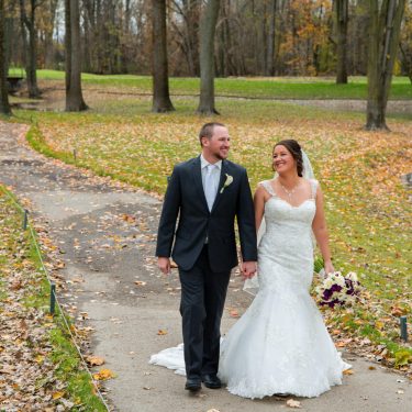 Married couple walking in MI park