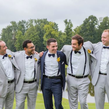 Groomsmen in in gray and navy blue