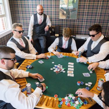 Groomsmen playing poker