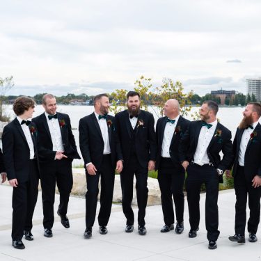 Groomsmen in black suits in MI