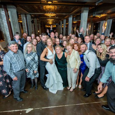 Wedding guests on dance floor in MI
