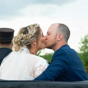 Couple kissing on carriage ride